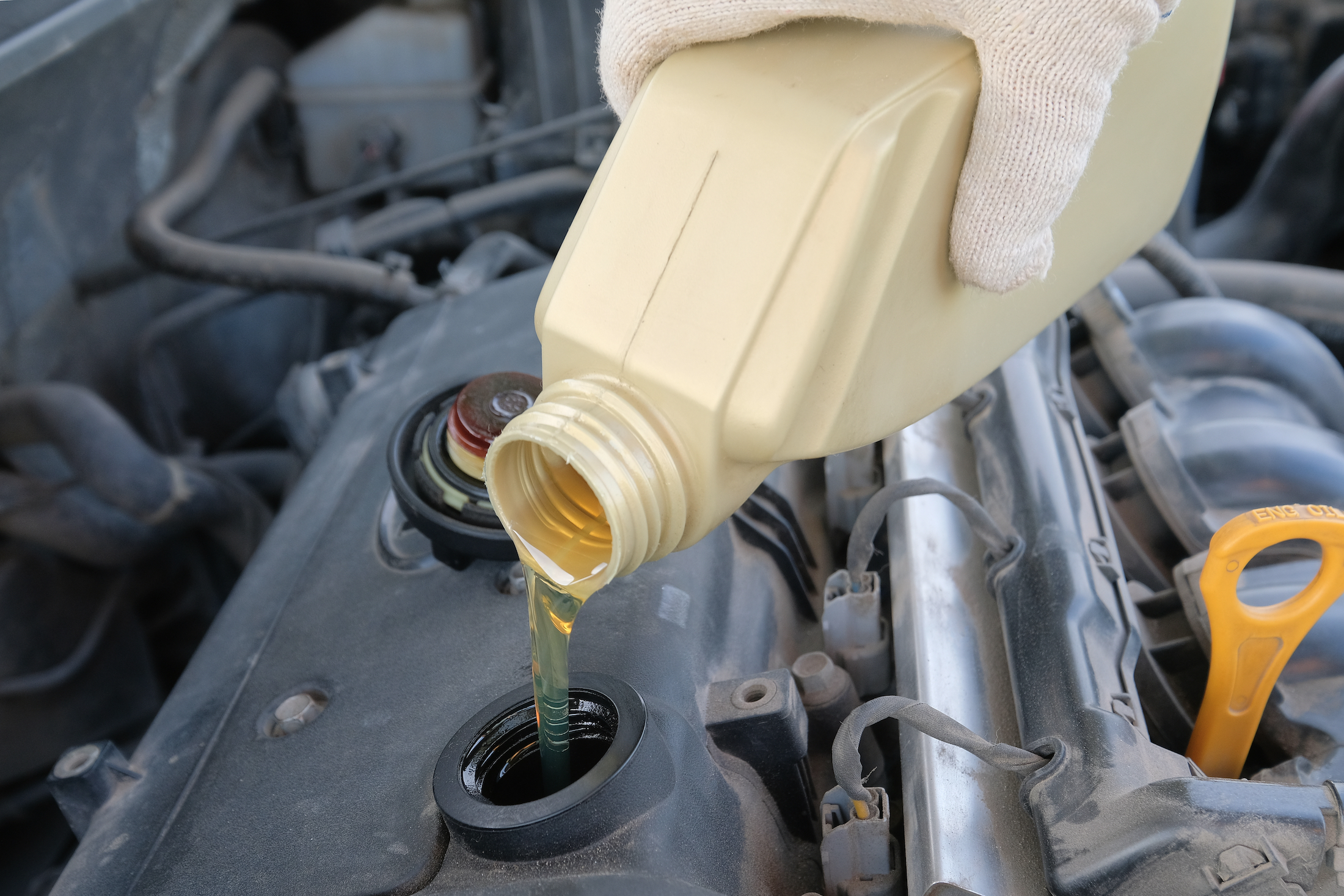 pouring engine oil